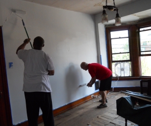Men painting with rollers