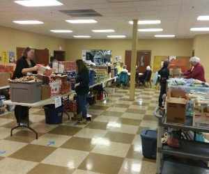 Volunteers putting together gift bags.