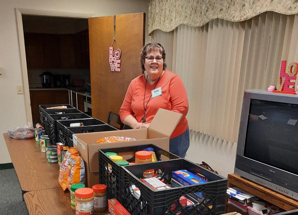 A volunteer works at the Mobile Senior Pantry